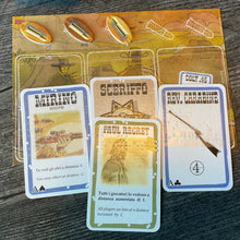 Load image into Gallery viewer, A close up of the player mat. The role card and the character card is shown along with the player's weapon and scope.
