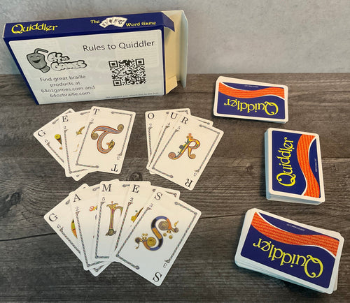 Cards laid out with transparent braille on them. The words 