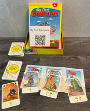 Load image into Gallery viewer, The game laid out on bean fields. Every card has the name of the card and trade in values on them in transparent braille.
