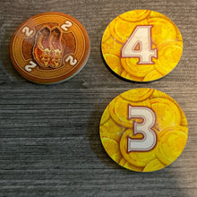 Load image into Gallery viewer, Brown tokens, showing both sides with transparent braille on them
