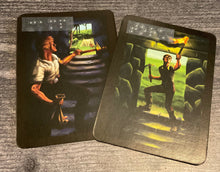 Load image into Gallery viewer, The camp and torch cards. They look pretty similar in print so a lot of players make a mistake and I've often heard it called the hardest part of the game but you won't because their names are in braille.
