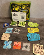Load image into Gallery viewer, A shot showing all the types of cards and cash. They all have transparent braille on them for gameplay
