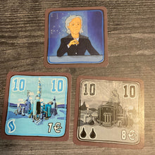 Load image into Gallery viewer, A blue CEO card and 2 factory cards, one for natural gas and one for oil. The cost, the amount of storage and rank are shown on the cards in braille
