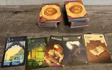 Load image into Gallery viewer, The regular gameplay cards are laid out. Most of these are just a number and a color although some have special functions. The functions are on the reference sheets.(they aren't on the cards in print either)
