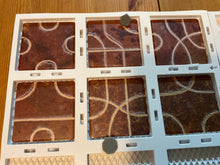Load image into Gallery viewer, A close up on the tiles and the 3d pieces. The tactile transparent stickers on the tiles can be seen. The tiles are firmly in the board's slots so they do not move around
