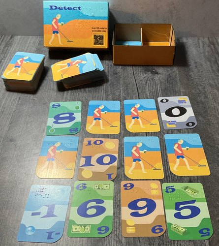 The box and one player with their field laid out in front of them