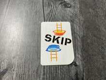 Load image into Gallery viewer, Close up on a skip portal card. It shows a later going into and coming out of a portal.
